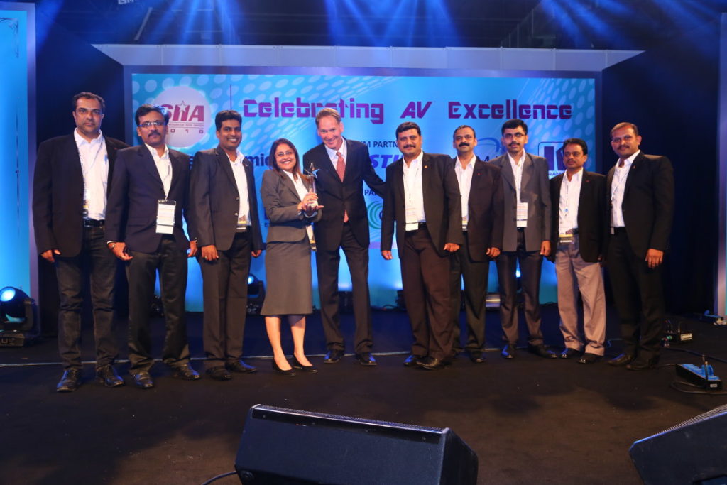 AVID with the award for Corporate category, with the premium budget range of ₹ 10 Cr and above. Aviv Ron (centre in tie) of Kramer presented the award